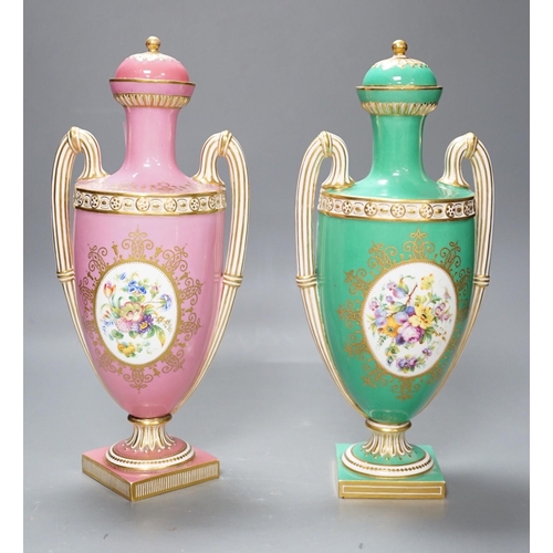 316 - A pair of Coalport Coalbrookdale two handled vases with central oval panelled floral painting and gi... 