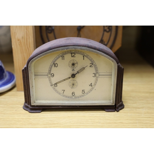 321 - A Black Forest cuckoo clock, together with another octagonal faced timepiece, a Bakelite timepiece a... 