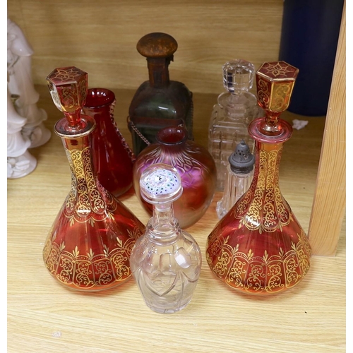 323 - A pair of Bohemian gilded ruby glass decanters and stoppers, a Bohemian millefiori paperweight sto... 