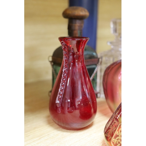 323 - A pair of Bohemian gilded ruby glass decanters and stoppers, a Bohemian millefiori paperweight sto... 