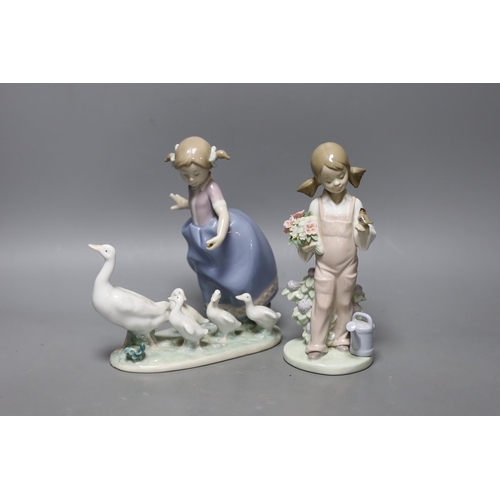 330 - A boxed Lladro figure and another