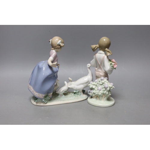 330 - A boxed Lladro figure and another