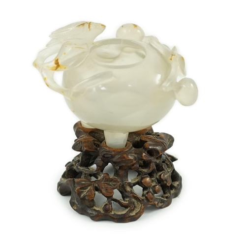 348 - A Chinese small carved agate brushwasher on wooden stand, 19th century