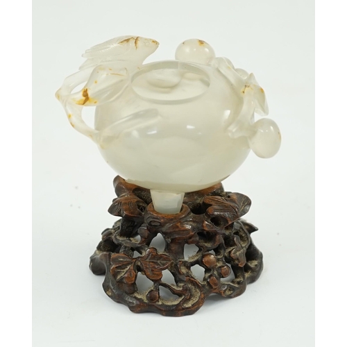 348 - A Chinese small carved agate brushwasher on wooden stand, 19th century