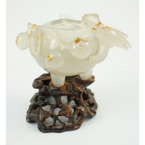 348 - A Chinese small carved agate brushwasher on wooden stand, 19th century