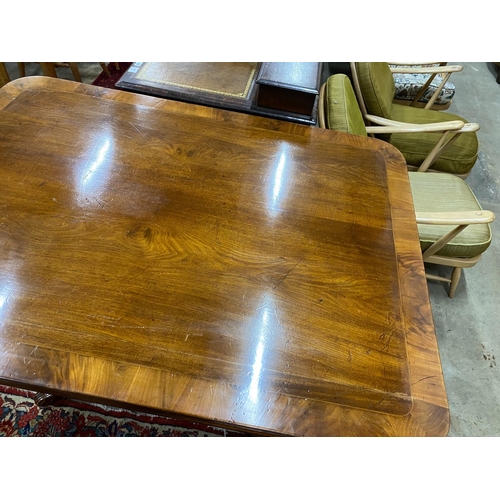 37 - A Regency banded mahogany rectangular tilt top dining table, length 141cm, depth 106cm, height 75cm... 