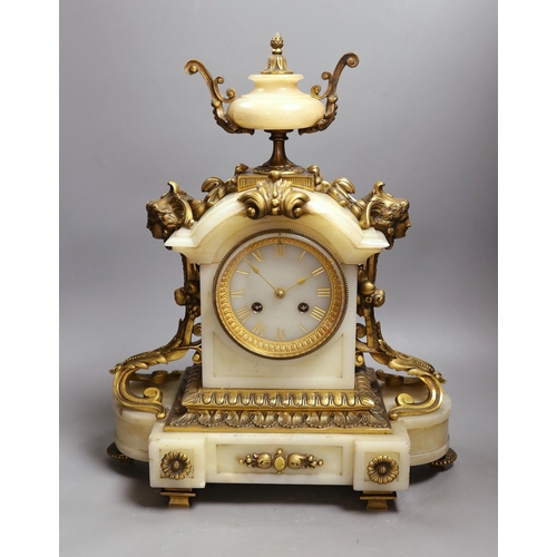 391 - A late 19th century French ormolu mounted alabaster mantel clock. 42cm tall