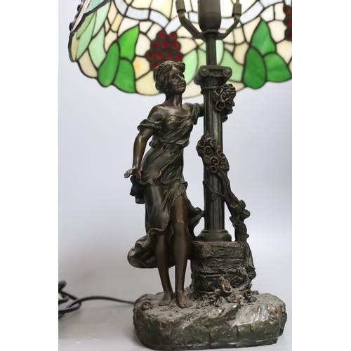 395 - A figural table lamp with Tiffany style shade 47cm