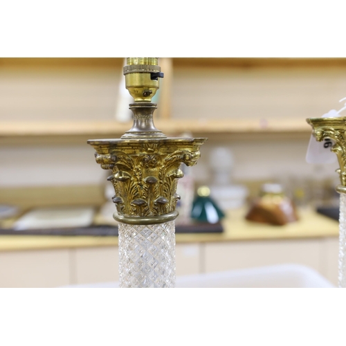 396 - A pair of brass and glass Corinthian column table lamps, 57cm total height