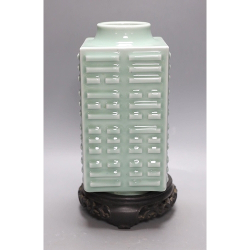 406 - A Chinese celadon eight trigrams vase, on stand. 32cm tall