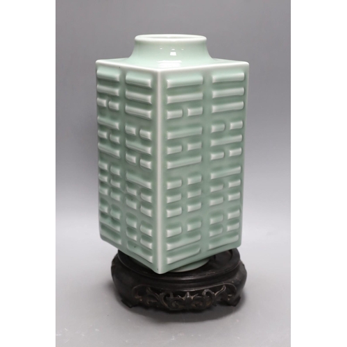 406 - A Chinese celadon eight trigrams vase, on stand. 32cm tall