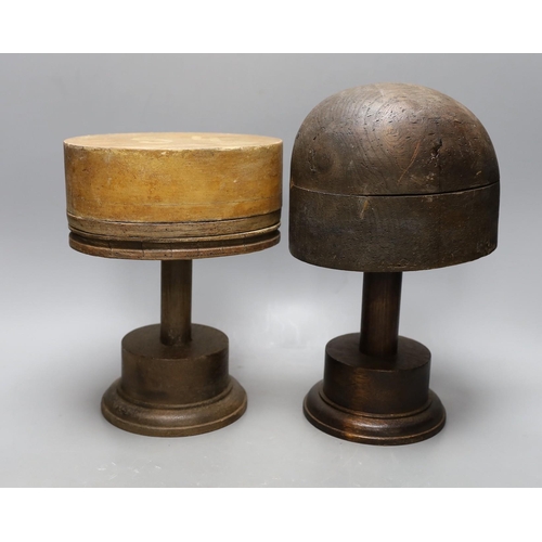 410 - A World War One German beechwood helmet mould, 34cm wide, and five hatters blocks