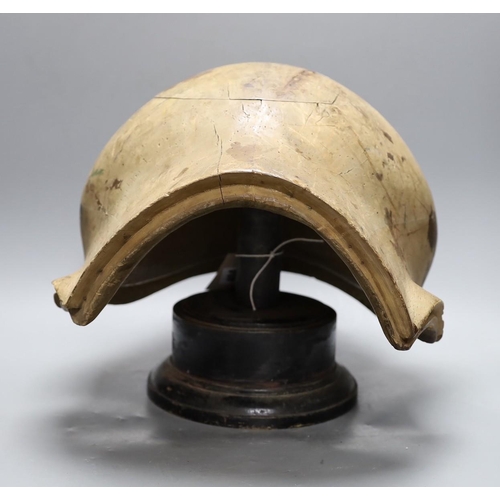 410 - A World War One German beechwood helmet mould, 34cm wide, and five hatters blocks