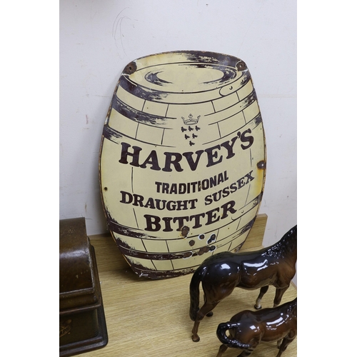 419 - A Harvey's traditional draught Sussex bitter keg enamel sign, with air rifle damage. 62cm tall... 