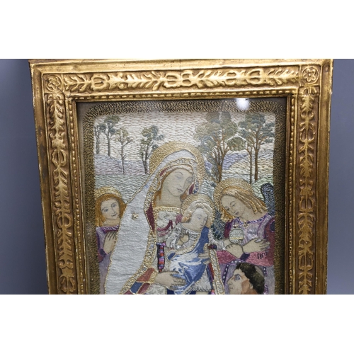 424 - A silk thread embroidery of the 'Madonna of Peace', 36x24cm including gilt frame