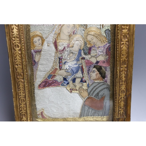 424 - A silk thread embroidery of the 'Madonna of Peace', 36x24cm including gilt frame