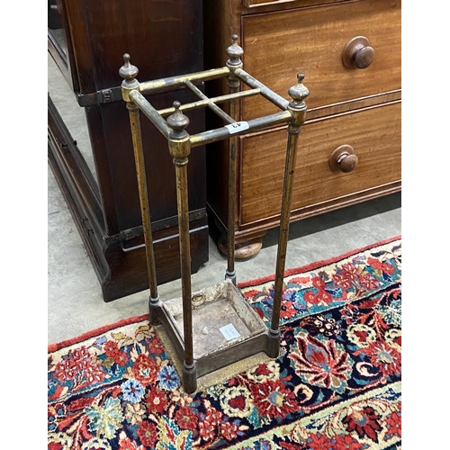 43 - A late Victorian cast iron and brass four division stick stand, height 63cm