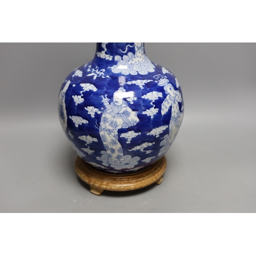 440 - A Chinese blue and white figural vase on hardwood stand, 40cm total height