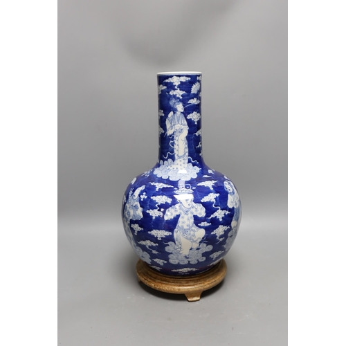 440 - A Chinese blue and white figural vase on hardwood stand, 40cm total height