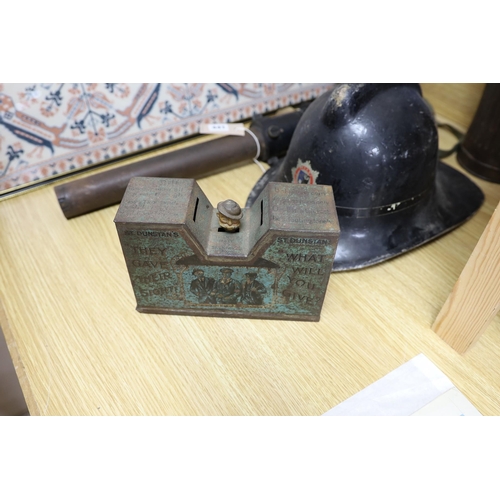 441 - A WW2 gas mask in original metal case, together with other related ephemera, including an enamelled ... 