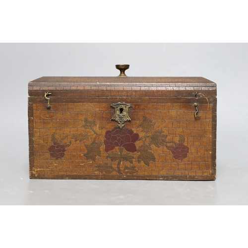 460 - A late 19th century incised and painted tea caddy with floral brick decoration. 24cm wide