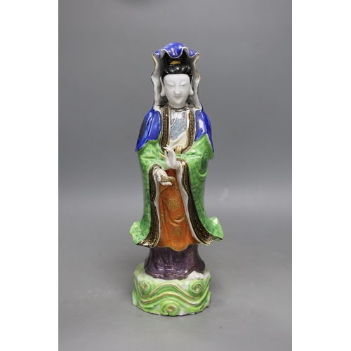 467 - A Chinese enamelled porcelain figure of Guanyin, Jiaqing - Daoguang period, damage, 34cms high,... 