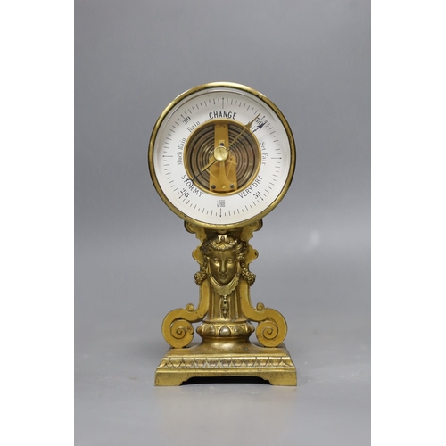 475 - A gilt metal aneroid barometer classical design, 19cms high