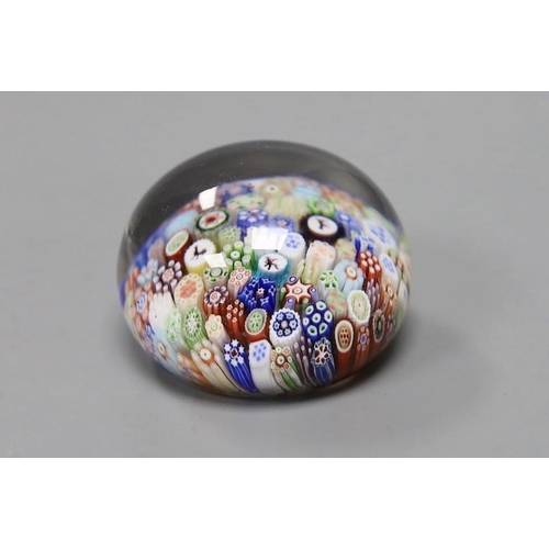 485 - A Baccarat millefiori paperweight, with dog, huntsman and cockerel silhouette canes, 4cms wide... 