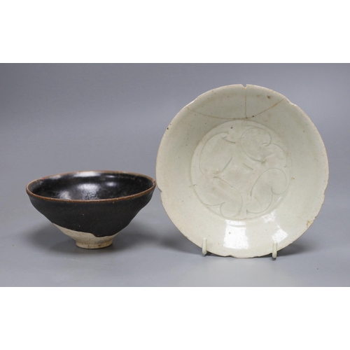 486 - A Chinese Jizhou scrolling leaf bowl, Song Dynasty, 11cm and a carved qingbai dish, 14cm