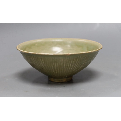 487 - A Chinese carved Yaozhou celadon bowl, Northern Song Dynasty, 15.5cms high