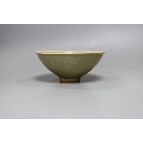 487 - A Chinese carved Yaozhou celadon bowl, Northern Song Dynasty, 15.5cms high