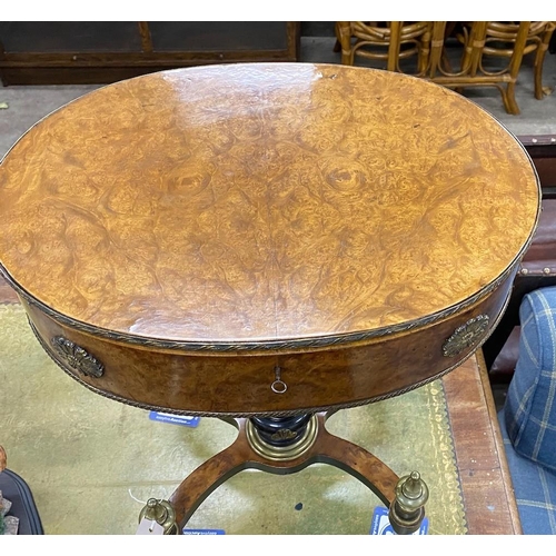 56 - An early 20th century French gilt metal mounted part ebonised bird's eye maple oval work table, widt... 