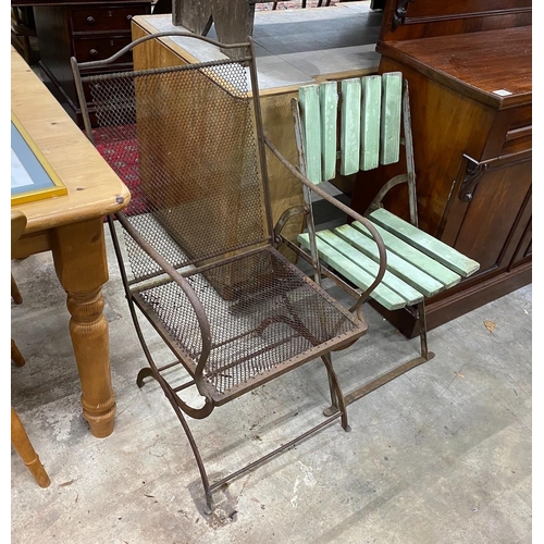 67 - A Victorian folding iron garden chair and a later folding garden chair