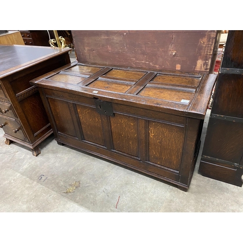 70 - A late 17th century and later country panelled oak coffer, length 126cm, depth 55cm, height 64cm... 