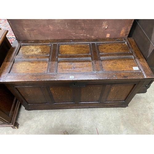 70 - A late 17th century and later country panelled oak coffer, length 126cm, depth 55cm, height 64cm... 