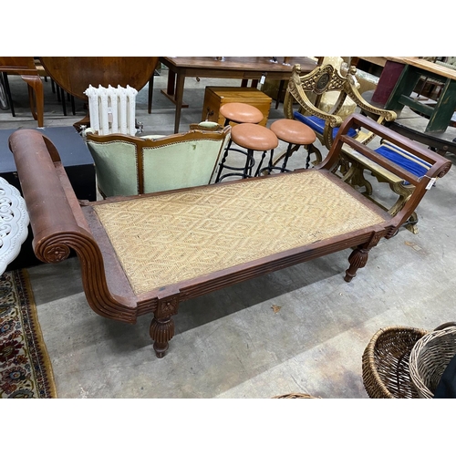 74 - An Indonesian caned hardwood daybed, length 212cm, depth 71cm, height 84cm