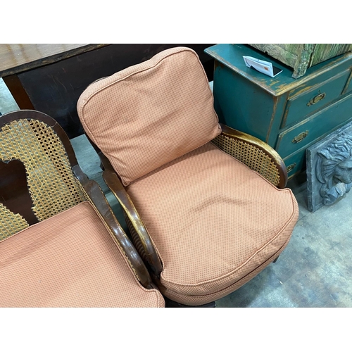 75 - A 1920's caned beech two piece bergere suite, settee length 168cm, depth 72cm, height 82cm