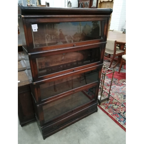 89 - A Globe Wernicke glazed oak four section bookcase, width 86cm, depth 27cm, height 140cm