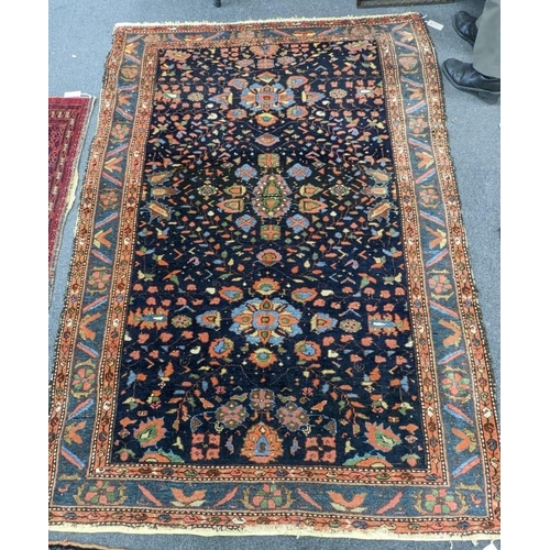 92 - An antique Malaya rug, 210 x 148cm