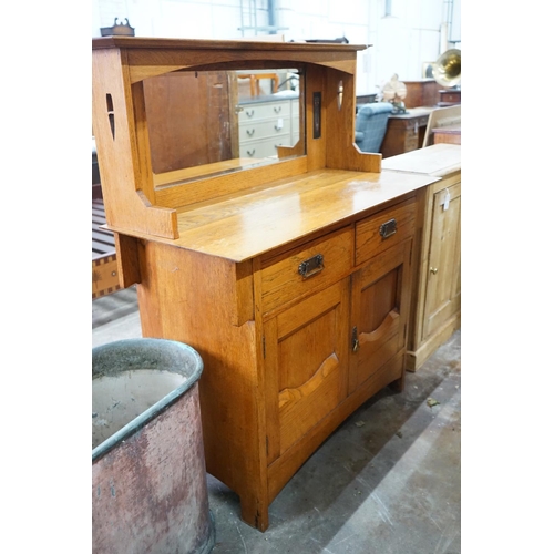 1002 - An Art Nouveau oak mirror back sideboard, length 122cm, depth 55cm, height 145cm