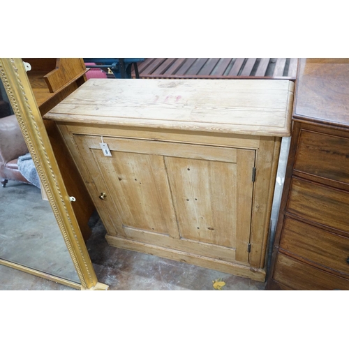 1003 - A Victorian panelled pine single door side cabinet, width 96cm, depth 35cm, height 94cm