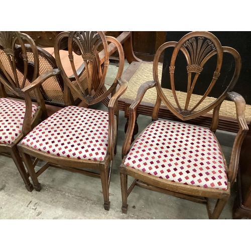 1011 - A set of eight Hepplewhite style mahogany dining chairs, two with arms