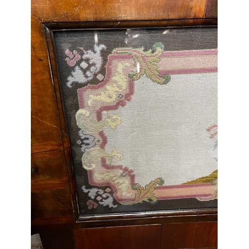 1016 - A Victorian rectangular walnut framed headboard with a floral tapestry panel, height 113cm