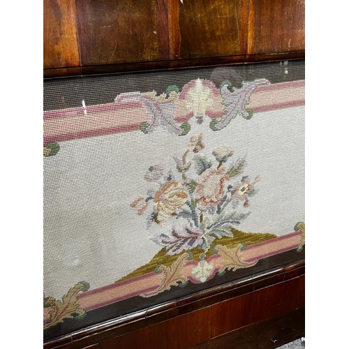 1016 - A Victorian rectangular walnut framed headboard with a floral tapestry panel, height 113cm