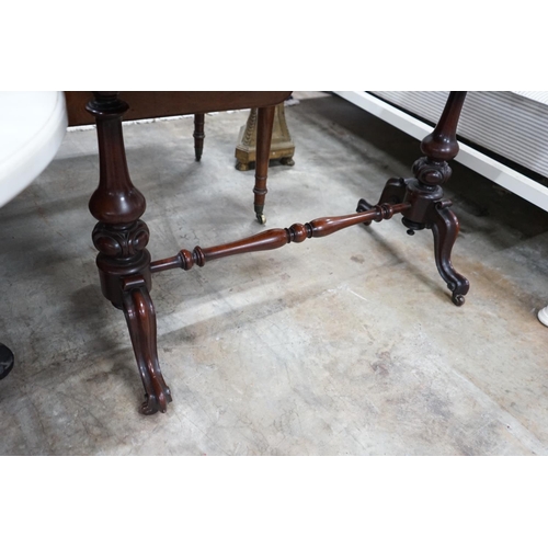 1023 - A Victorian mahogany stretcher table, length 106cm, depth 52cm, height 75cm