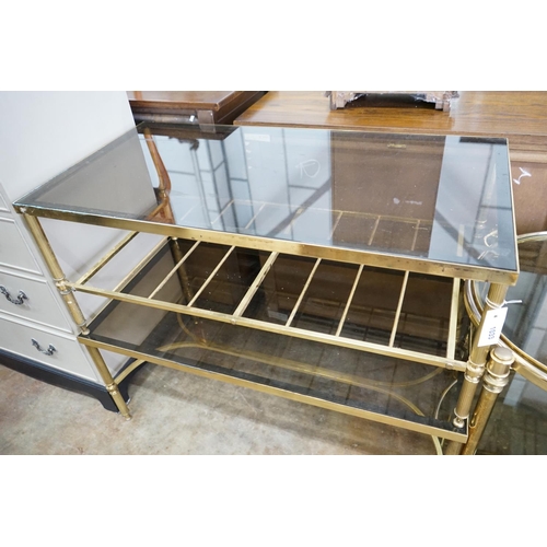 1033 - A brass and smoked glass two tier rectangular coffee table, width 99cm, depth 51cm, height 41cm... 