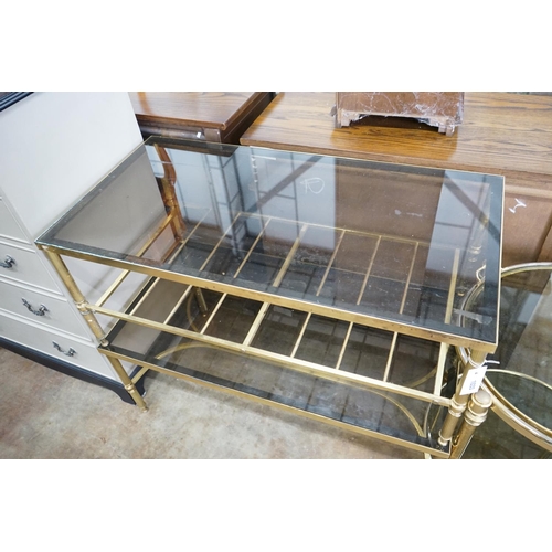 1033 - A brass and smoked glass two tier rectangular coffee table, width 99cm, depth 51cm, height 41cm... 