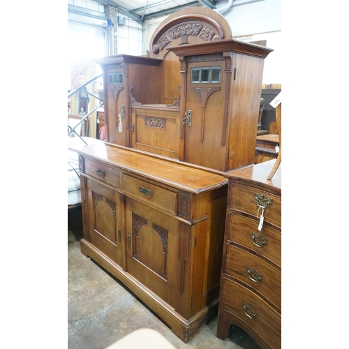 1041 - An early 20th century German Art Nouveau walnut buffet, length 141cm, depth 64cm, height 197cm... 