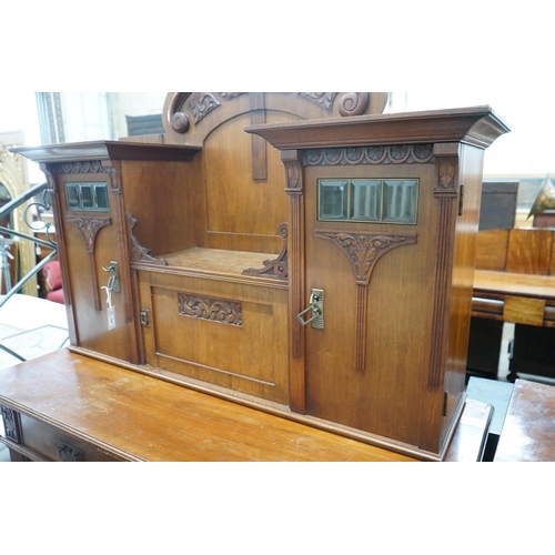 1041 - An early 20th century German Art Nouveau walnut buffet, length 141cm, depth 64cm, height 197cm... 