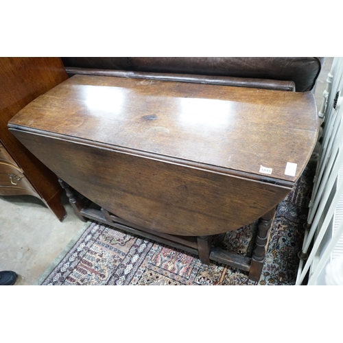 1045 - An 18th century oak gateleg dining table, length 141cm extended, width 120cm, height 74cm